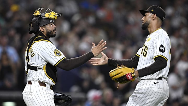 Aug 20, 2024; San Diego, California, USA; San Diego Padres catcher Luis Campusano (12) and relief pitcher Robert Suarez (75) celebrate on the field after defeating the Minnesota Twins at Petco Park. Mandatory Credit: Orlando Ramirez-Imagn Images Aug 20, 2024; San Diego, California, USA; San Diego Padres catcher Luis Campusano (12) and relief pitcher Robert Suarez (75) celebrate on the field after defeating the Minnesota Twins at Petco Park. Mandatory Credit: Orlando Ramirez-Imagn Images