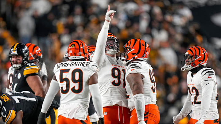 Cincinnati Bengals defensive end Trey Hendrickson (91) celebrates after sacking Pittsburgh Steelers quarterback Russell Wilson (3) in the first quarter of the NFL Week 18 game between the Pittsburgh Steelers and the Cincinnati Bengals at Acrisure Stadium in Pittsburgh on Saturday, Jan. 4, 2025.