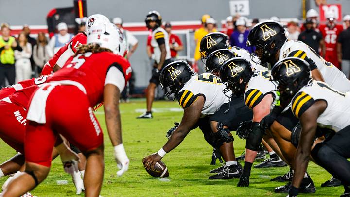 Sep 26, 2026; Raleigh, North Carolina, USA; App State Mountaineers face off against NC State Wolfpack during the second half of the game at Carter-Finley Stadium. Mandatory Credit: Jaylynn Nash-Imagn Images Sep 26, 2026; Raleigh, North Carolina, USA; App State Mountaineers face off against NC State Wolfpack during the second half of the game at Carter-Finley Stadium. Mandatory Credit: Jaylynn Nash-Imagn Images