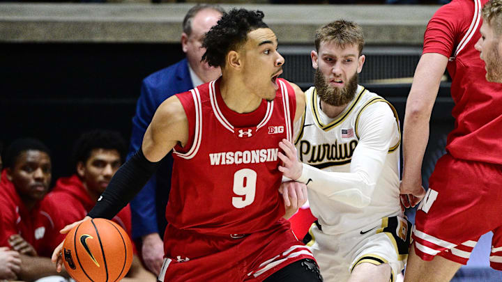Wisconsin Badgers guard John Tonje (9) controls the ball as Purdue Boilermakers guard Braden Smith (3) defends Wisconsin Badgers guard John Tonje (9) controls the ball as Purdue Boilermakers guard Braden Smith (3) defends