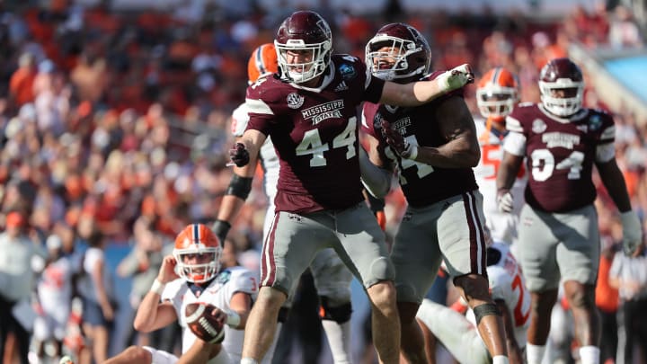 Jan 2, 2023; Tampa, FL, USA; Mississippi State Bulldogs linebacker Jett Johnson (44) celebrates after he sacked Illinois Fighting Illini wide receiver Keion Battle (83) during the second half in the 2023 ReliaQuest Bowl at Raymond James Stadium. Mandatory Credit: Kim Klement-USA TODAY Sports Jan 2, 2023; Tampa, FL, USA; Mississippi State Bulldogs linebacker Jett Johnson (44) celebrates after he sacked Illinois Fighting Illini wide receiver Keion Battle (83) during the second half in the 2023 ReliaQuest Bowl at Raymond James Stadium. Mandatory Credit: Kim Klement-USA TODAY Sports