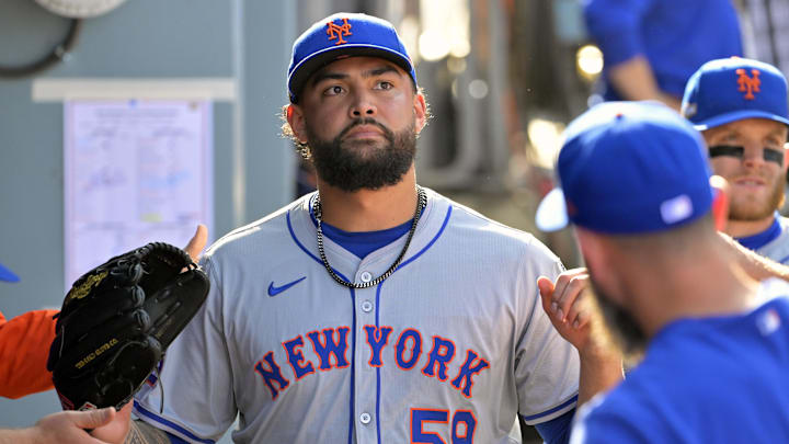 Oct 14, 2024; Los Angeles, California, USA; New York Mets pitcher Sean Manaea (59) greets teammates in the dugout after being relieved in the sixth inning against the Los Angeles Dodgers during game two of the NLCS for the 2024 MLB Playoffs at Dodger Stadium. Mandatory Credit: Jayne Kamin-Oncea-Imagn Images