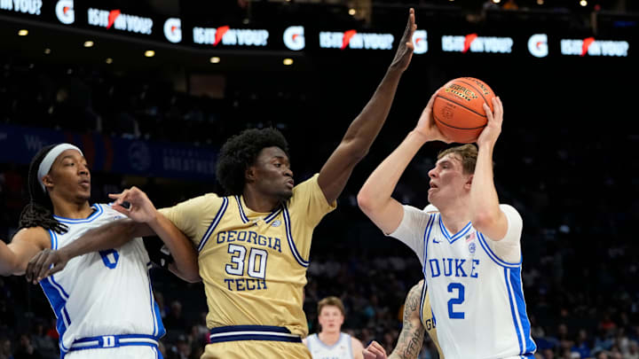 Mar 13, 2025; Charlotte, NC, USA; Duke Blue Devils forward Cooper Flagg (2) with the ball as Georgia Tech Yellow Jackets forward Ibrahim Souare (30) defends in the first half at Spectrum Center. Mandatory Credit: Bob Donnan-Imagn Images Mar 13, 2025; Charlotte, NC, USA; Duke Blue Devils forward Cooper Flagg (2) with the ball as Georgia Tech Yellow Jackets forward Ibrahim Souare (30) defends in the first half at Spectrum Center. Mandatory Credit: Bob Donnan-Imagn Images