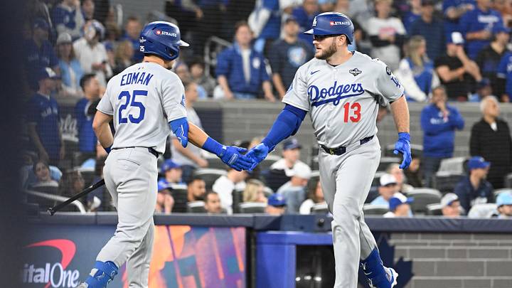 Oct 25, 2025; Toronto, Ontario, CAN; Los Angeles Dodgers third baseman Max Muncy (13) celebrates after hitting a solo home run against the Toronto Blue Jays with second baseman Tommy Edman (25) in the seventh inning during game two of the 2025 MLB World Series at Rogers Centre. Mandatory Credit: Dan Hamilton-Imagn Images Oct 25, 2025; Toronto, Ontario, CAN; Los Angeles Dodgers third baseman Max Muncy (13) celebrates after hitting a solo home run against the Toronto Blue Jays with second baseman Tommy Edman (25) in the seventh inning during game two of the 2025 MLB World Series at Rogers Centre. Mandatory Credit: Dan Hamilton-Imagn Images
