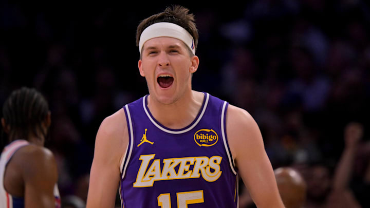 Feb 5, 2026; Los Angeles, California, USA;  Los Angeles Lakers guard Austin Reaves (15) reacts at the buzzer defeating the Philadelphia 76ers at Crypto.com Arena. Mandatory Credit: Jayne Kamin-Oncea-Imagn Images