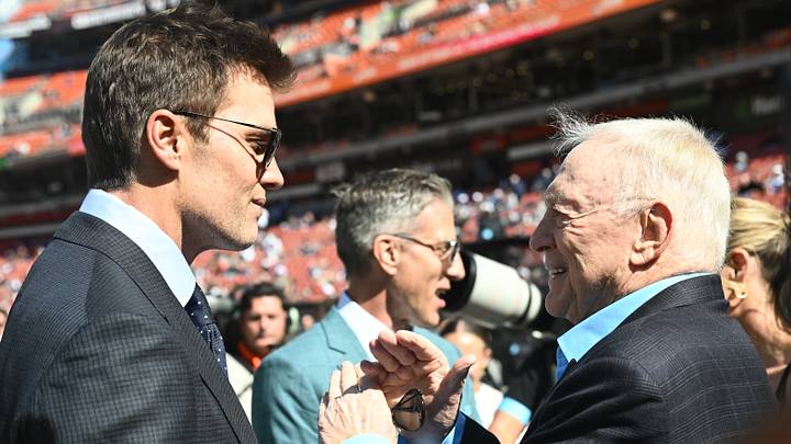 Fox Sports' Tom Brady talks to Dallas Cowboys owner Jerry Jones before a game against the Cleveland Browns at Huntington Bank Field Fox Sports' Tom Brady talks to Dallas Cowboys owner Jerry Jones before a game against the Cleveland Browns at Huntington Bank Field