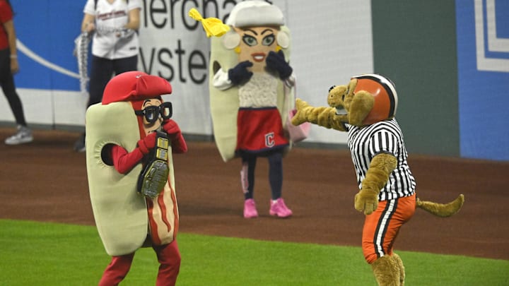 Aug 19, 2023: Cleveland Browns mascot Chomps throws a penalty flag after a hot dog mascot race between innings of a game between the Cleveland Guardians and the Detroit Tigers at Progressive Field. 