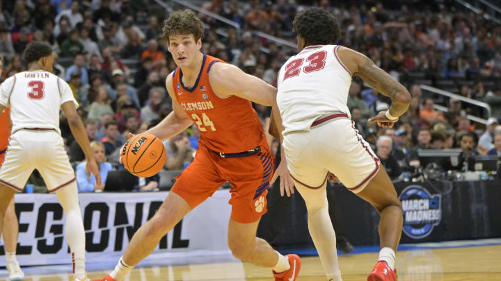 Mar 30, 2024; Los Angeles, CA, USA; Clemson Tigers center PJ Hall (24) controls the ball against Alabama Crimson Tide forward Nick Pringle (23) in the first half in the finals of the West Regional of the 2024 NCAA Tournament at Crypto.com Arena. Mar 30, 2024; Los Angeles, CA, USA; Clemson Tigers center PJ Hall (24) controls the ball against Alabama Crimson Tide forward Nick Pringle (23) in the first half in the finals of the West Regional of the 2024 NCAA Tournament at Crypto.com Arena.
