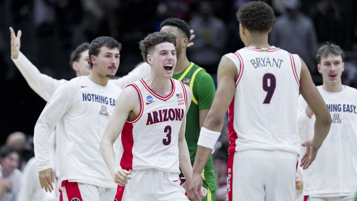 Arizona Wildcats guard Anthony Dell'Orso (3) celebrates with forward Carter Bryant (9) after defeating the Oregon Ducks in the NCAA Tournament.