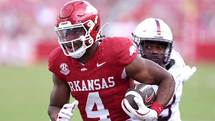 Arkansas Razorbacks running back Mike Washington Jr (4) rushes during the fourth quarter against the Alabama A&M Bulldogs at Razorback Stadium. Arkansas Razorbacks running back Mike Washington Jr (4) rushes during the fourth quarter against the Alabama A&M Bulldogs at Razorback Stadium.