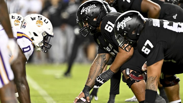 Texas A&M Aggies offensive lineman Kolinu'u Faaiu (61) sets the ball in the fourth quarter against the LSU Tigers at Kyle Field. Texas A&M Aggies offensive lineman Kolinu'u Faaiu (61) sets the ball in the fourth quarter against the LSU Tigers at Kyle Field.