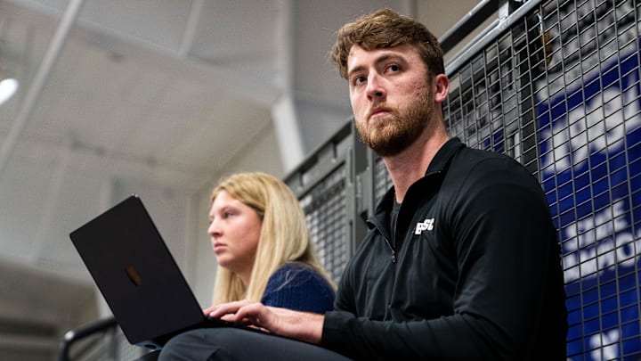 White Sox pitcher and Indianola Independent Advocate reporter Duncan Davitt watches as he covers a Norwalk girls basketball game on Nov. 24, 2025, at Norwalk High School.