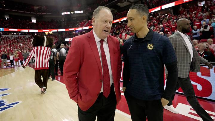 Wisconsin head coach Greg Gard, left, and Marquette head coach Shaka Smart. Wisconsin head coach Greg Gard, left, and Marquette head coach Shaka Smart.
