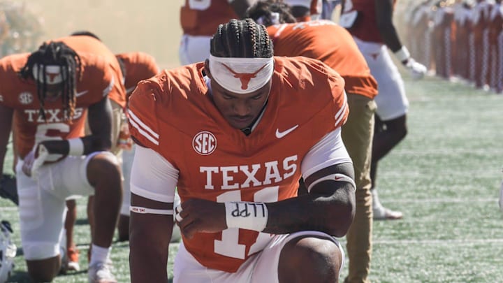 Texas Longhorns linebacker Colin Simmons (11) kneels before the Texas Longhorns take on Mississippi State at Darrell K Royal-Texas Memorial Stadium in Austin on Saturday, Sept. 28, 2024.