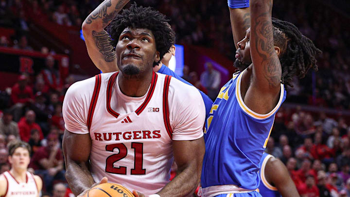 Jan 13, 2025; Piscataway, New Jersey, USA; Rutgers Scarlet Knights center Emmanuel Ogbole (21) looks to the basket as UCLA Bruins guard Sebastian Mack (12) defends during the second half at Jersey Mike's Arena. Mandatory Credit: Vincent Carchietta-Imagn Images Jan 13, 2025; Piscataway, New Jersey, USA; Rutgers Scarlet Knights center Emmanuel Ogbole (21) looks to the basket as UCLA Bruins guard Sebastian Mack (12) defends during the second half at Jersey Mike's Arena. Mandatory Credit: Vincent Carchietta-Imagn Images