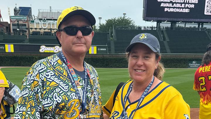 Rick and Meredith Apfel on field at historic Wrigley Field prior to Banana Ball game Rick and Meredith Apfel on field at historic Wrigley Field prior to Banana Ball game