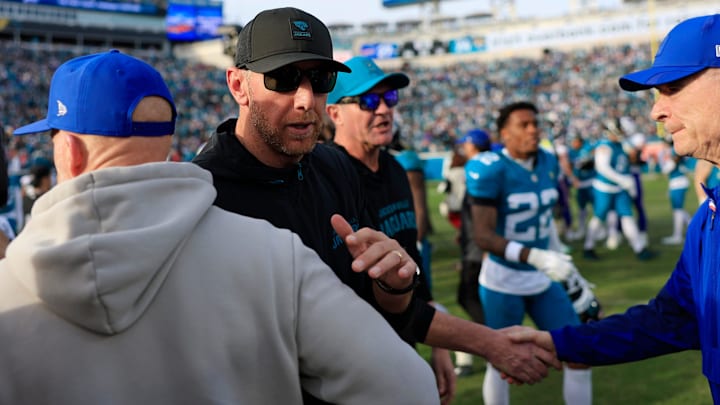 Jacksonville Jaguars head coach Liam Coen, center left, greets Buffalo Bills head coach Sean McDermott after the game of an NFL football AFC Wild Card playoff matchup, Sunday, Jan. 11, 2026, in Jacksonville, Fla. The Bills defeated the Jaguars 27-24. [Corey Perrine/Florida Times-Union]