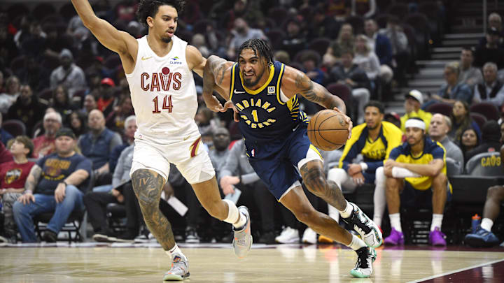 Oct 10, 2024; Cleveland, Ohio, USA; Cleveland Cavaliers guard Jules Bernard (14) defends Indiana Pacers forward Obi Toppin (1) in the first quarter at Rocket Mortgage FieldHouse. Mandatory Credit: David Richard-Imagn Images