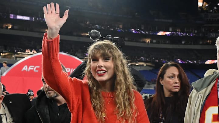 Jan 28, 2024; Baltimore, Maryland, USA; American singer-songwriter Taylor Swift (center) walks off