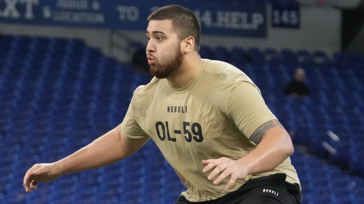 Mar 3, 2024; Indianapolis, IN, USA; Kansas offensive lineman Dominick Puni (OL59) during the 2024 NFL Combine at Lucas Oil Stadium. Mandatory Credit: Kirby Lee-USA TODAY Sports Mar 3, 2024; Indianapolis, IN, USA; Kansas offensive lineman Dominick Puni (OL59) during the 2024 NFL Combine at Lucas Oil Stadium. Mandatory Credit: Kirby Lee-USA TODAY Sports
