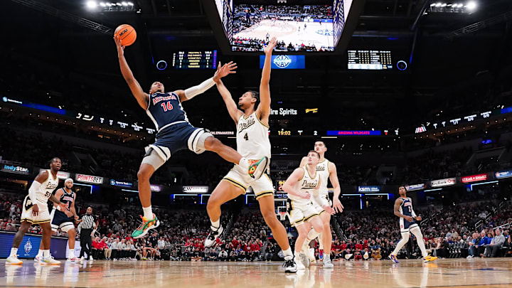 Dec 16, 2023; Indianapolis, Indiana, USA; Arizona Wildcats forward Keshad Johnson (16) attempts a shot against Purdue Boilermakers forward Trey Kaufman-Renn (4) during the first half at Gainbridge Fieldhouse. Mandatory Credit: Robert Goddin-Imagn Images Dec 16, 2023; Indianapolis, Indiana, USA; Arizona Wildcats forward Keshad Johnson (16) attempts a shot against Purdue Boilermakers forward Trey Kaufman-Renn (4) during the first half at Gainbridge Fieldhouse. Mandatory Credit: Robert Goddin-Imagn Images