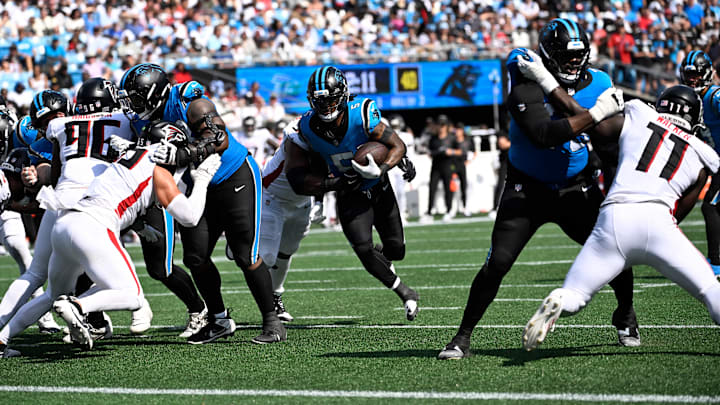 Sep 21, 2025; Charlotte, North Carolina, USA;  Carolina Panthers running back Rico Dowdle (5) runs in the fourth quarter at Bank of America Stadium. Mandatory Credit: Bob Donnan-Imagn Images
