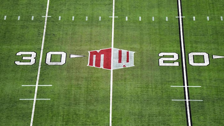 The Mountain West conference logo on the field at Allegiant Stadium. Mandatory Credit: Kirby Lee-Imagn Images