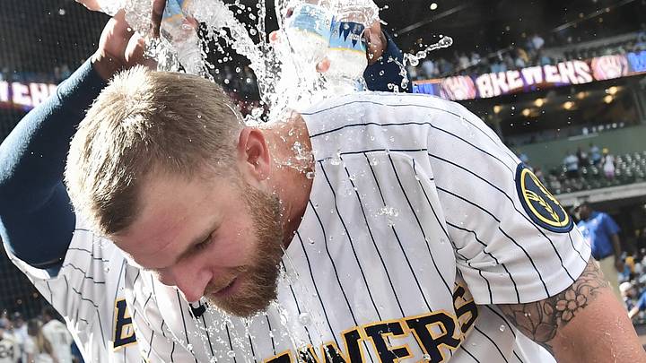 Aug 22, 2026; Milwaukee, Wisconsin, USA;  Milwaukee Brewers right fielder Jake Bauers (9) celebrates with teammates after beating the Atlanta Braves at American Family Field.  Mandatory Credit: Benny Sieu-Imagn Images