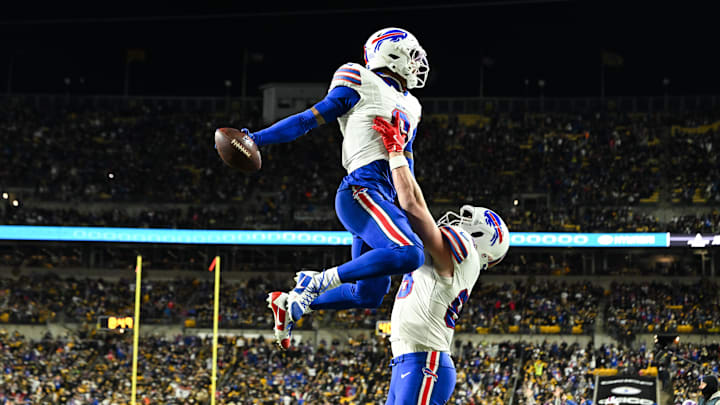 Buffalo Bills wide receiver Keon Coleman (0) celebrates with Buffalo Bills tight end Dawson Knox (88) after scoring a touchdown during the third quarter against the Pittsburgh Steelers at Acrisure Stadium.