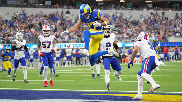 Dec 8, 2024; Inglewood, California, USA; Los Angeles Rams wide receiver Puka Nacua (17) scores on a 4-yard touchdown run in the second quarter against the Buffalo Bills at SoFi Stadium. Mandatory Credit: Kirby Lee-Imagn Images