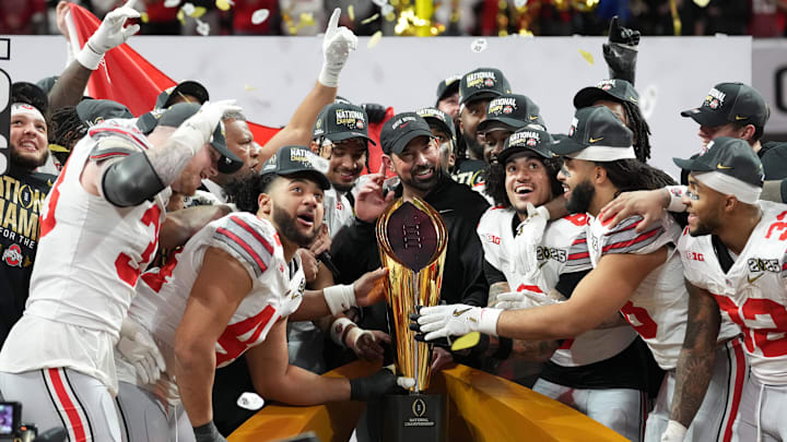 Ohio State Buckeyes football players celebrate with head coach Ryan Day after winning the CFP National Championship on Jan 20, 2025.
