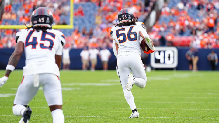 Aug 25, 2024; Denver, Colorado, USA; Denver Broncos linebacker Levelle Bailey (56) returns a interception for six points in the fourth quarter against the Arizona Cardinals at Empower Field at Mile High. 