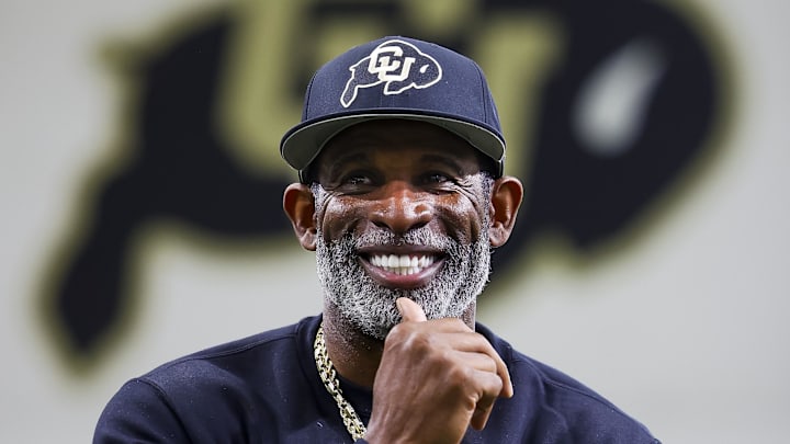 Apr 4, 2025; Boulder, CO, USA; Colorado Buffaloes head coach Deion Sanders watches as his players go through drills at the University of Colorado NFL Showcase at the CU Indoor Practice Facility. Mandatory Credit: Michael Ciaglo-Imagn Images