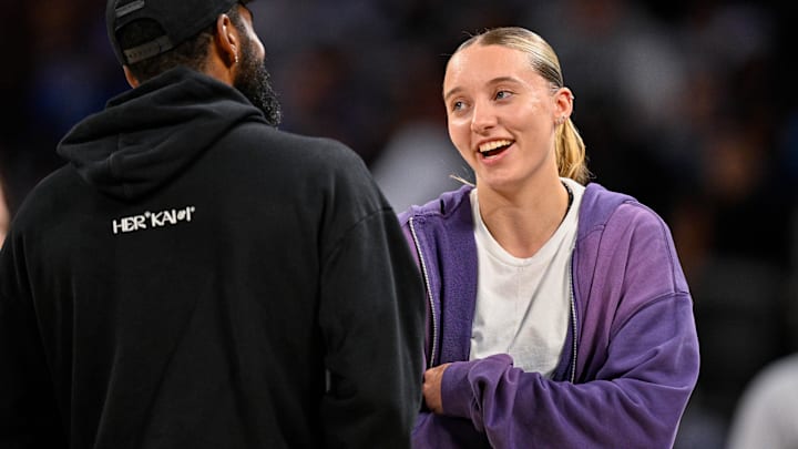 Oct 6, 2025; Fort Worth, Texas, USA; Dallas Mavericks guard Kyrie Irving (left) talks with Dallas Wings guard Paige Bueckers (right) during the second half of the game between the Mavericks and the Oklahoma City Thunder at Dickie's Arena. Mandatory Credit: Jerome Miron-Imagn Images Oct 6, 2025; Fort Worth, Texas, USA; Dallas Mavericks guard Kyrie Irving (left) talks with Dallas Wings guard Paige Bueckers (right) during the second half of the game between the Mavericks and the Oklahoma City Thunder at Dickie's Arena. Mandatory Credit: Jerome Miron-Imagn Images