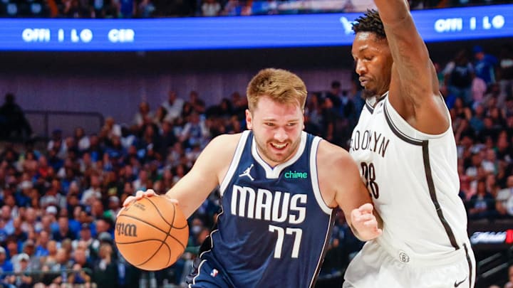 Oct 27, 2023; Dallas, Texas, USA; Dallas Mavericks guard Luka Doncic (77) drives on Brooklyn Nets forward Dorian Finney-Smith (28) during the second quarter at American Airlines Center. Mandatory Credit: Andrew Dieb-Imagn Images