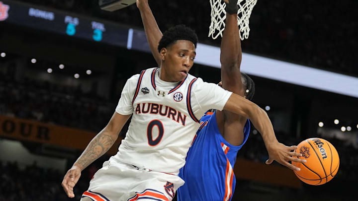 Apr 5, 2025; San Antonio, TX, USA;  Auburn Tigers guard Tahaad Pettiford (0) passes the ball against the Florida Gators in the semifinals of the men's Final Four of the 2025 NCAA Tournament at the Alamodome. Mandatory Credit: Robert Deutsch-Imagn Images Apr 5, 2025; San Antonio, TX, USA;  Auburn Tigers guard Tahaad Pettiford (0) passes the ball against the Florida Gators in the semifinals of the men's Final Four of the 2025 NCAA Tournament at the Alamodome. Mandatory Credit: Robert Deutsch-Imagn Images