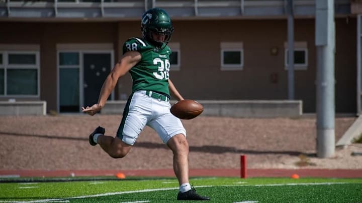 Trevor Allen is shown punting at Adams State.