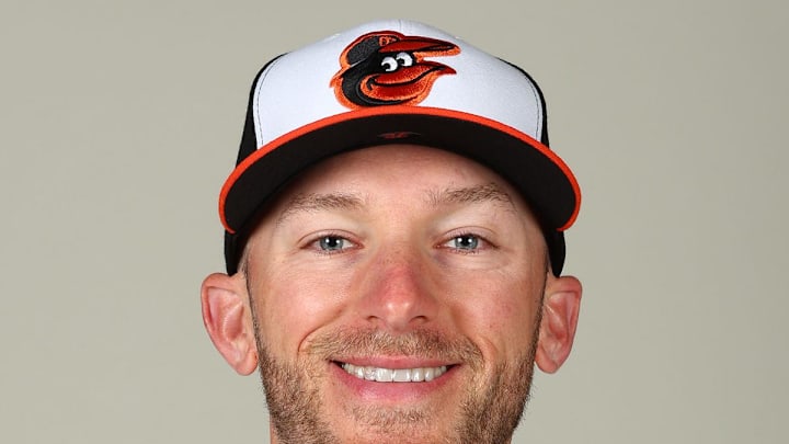 Baltimore Orioles coach Ryan Fuller (72) poses for a photo at Ed Smith Stadium. 
