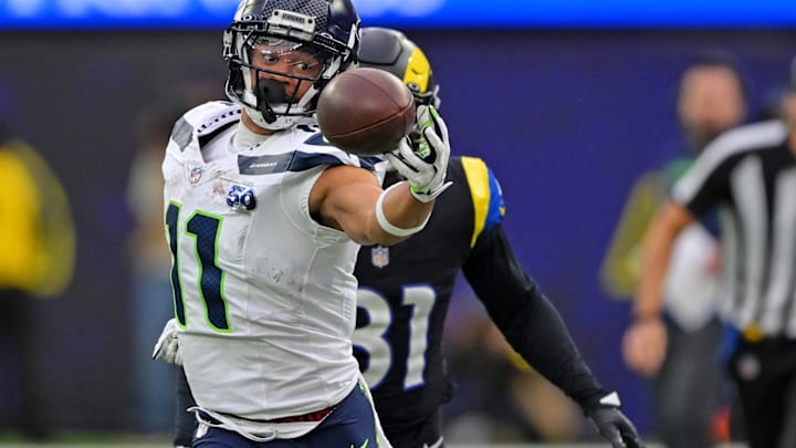Nov 16, 2025; Inglewood, California, USA; Seattle Seahawks wide receiver Jaxon Smith-Njigba (11) makes a one handed catch against Los Angeles Rams cornerback Darious Williams (31) during the first half at SoFi Stadium. 