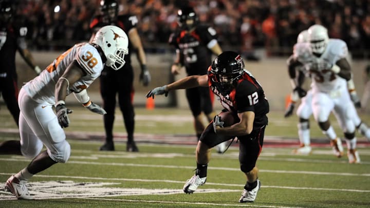 November 1, 2008; Lubbock, TX, USA; Texas Tech Red Raiders receiver Eric Morris (12) carries the ball against the Texas Longhorns in the first quarter at Jones AT&T Stadium. Mandatory Credit: Brendan Maloney-Imagn Images