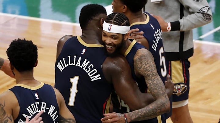 New Orleans Pelicans forward Zion Williamson (1) hugs forward Brandon Ingram (14) after their win over the Boston Celtics at TD Garden. Mandatory Credit: Winslow Townson-Imagn Images