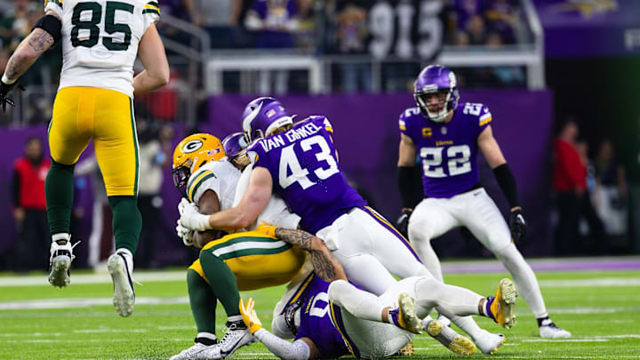 Andrew Van Ginkel (43) makes a tackle against the Packers while Harrison Smith (22) watches in the background. Andrew Van Ginkel (43) makes a tackle against the Packers while Harrison Smith (22) watches in the background.