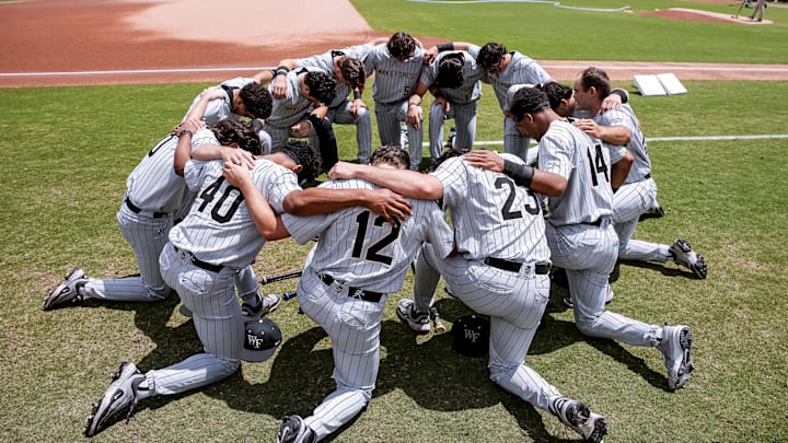 Wake Forest Baseball's team huddle before facing the Miami Hurricanes.