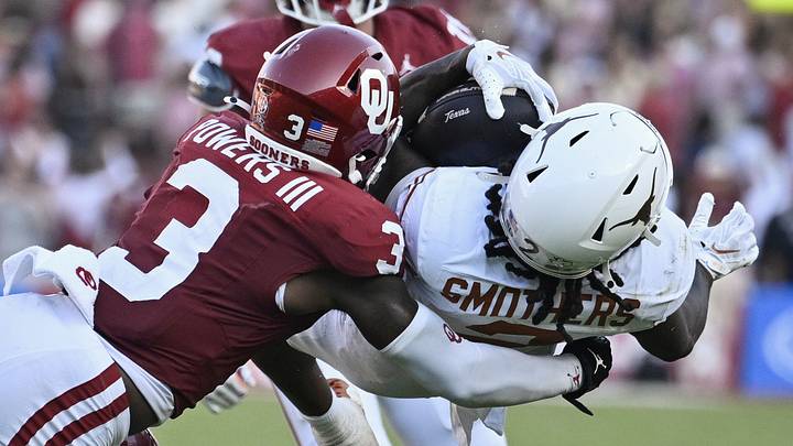 Oct 10, 2026; Dallas, Texas, USA;  Oklahoma Sooners defensive back Reggie Powers III tackles Texas Longhorns running back Hollywood Smothers