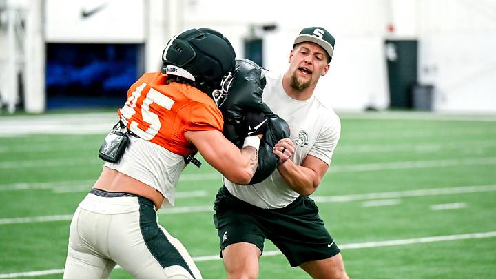 Michigan State's co-defensive coordinator/linebackers coach Max Bullough, right, works with Brady Pretzlaff during spring football practice on Tuesday, April 14, 2026, in East Lansing.
