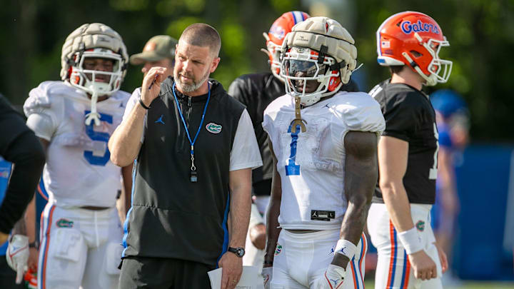 Florida head coach Billy Napier coaches Florida running back Montrell Johnson Jr. (1) during Florida