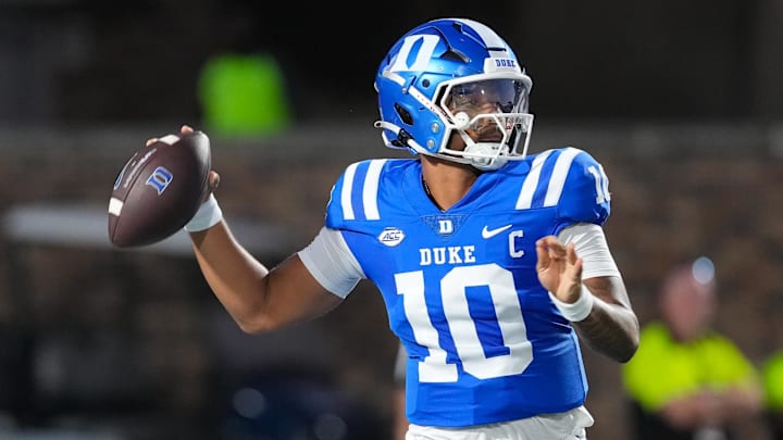 Aug 28, 2025; Durham, North Carolina, USA;  Duke Blue Devils quarterback Darian Mensah (10) goes to throw the ball against the Elon Phoenix during the first half at Wallace Wade Stadium. Mandatory Credit: James Guillory-Imagn Images