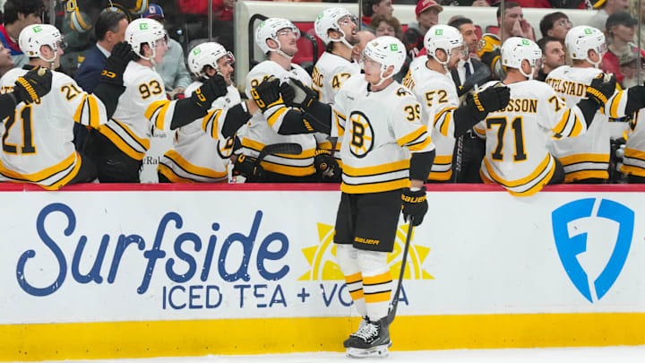 Apr 7, 2026; Raleigh, North Carolina, USA; Boston Bruins center Morgan Geekie (39) celebrates his goal against the Carolina Hurricanes during the first period at Lenovo Center. Mandatory Credit: James Guillory-Imagn Images Apr 7, 2026; Raleigh, North Carolina, USA; Boston Bruins center Morgan Geekie (39) celebrates his goal against the Carolina Hurricanes during the first period at Lenovo Center. Mandatory Credit: James Guillory-Imagn Images