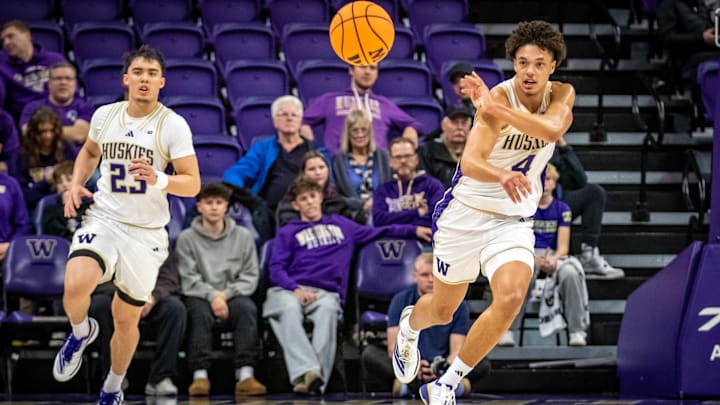 Jasir Rencher runs the fast break for the Huskies. Jasir Rencher runs the fast break for the Huskies.