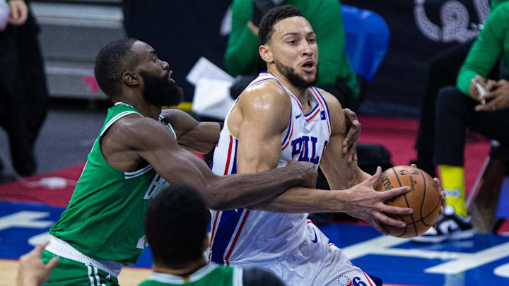 Former Philadelphia 76ers guard Ben Simmons (25) is fouled by Boston Celtics guard Jaylen Brown (7) while driving for a shot during the second quarter at Wells Fargo Center.